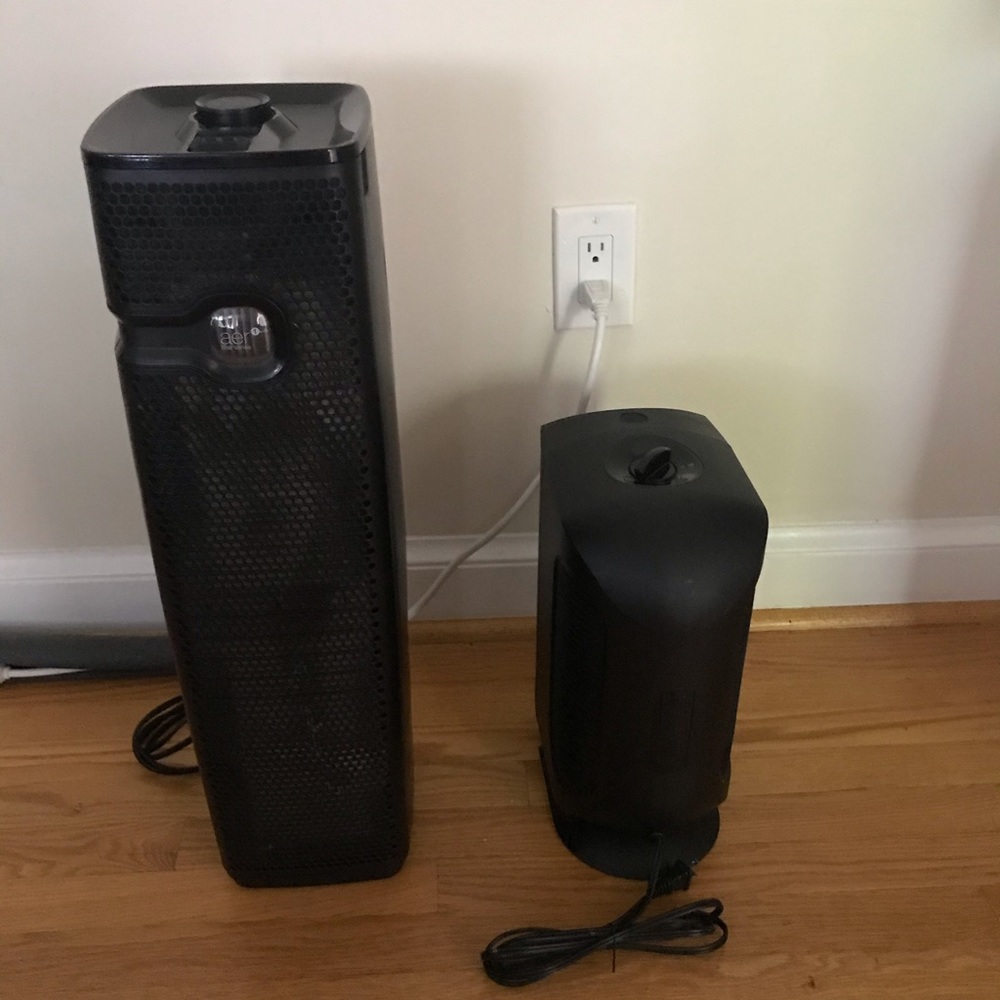 2 black air purifiers. Holmes and True Air